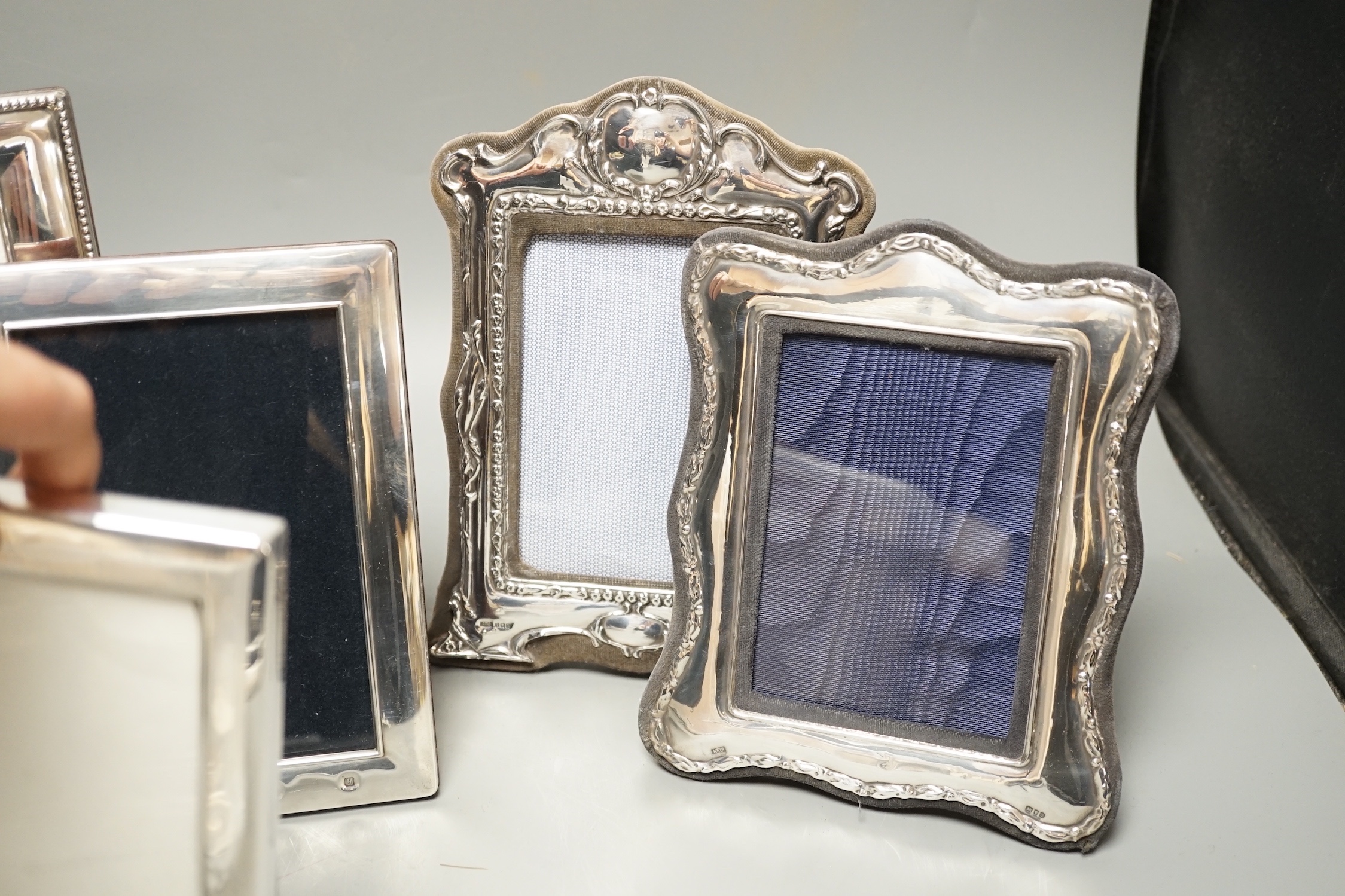 Four assorted modern silver mounted photograph frames, largest 22.2cm and an E.P.N.S. mounted photograph frame.